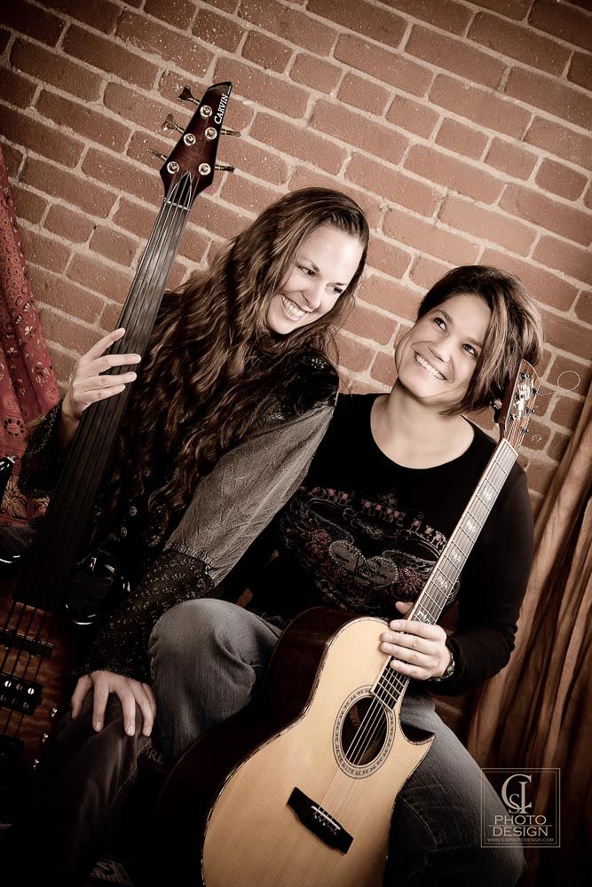 female_musicians_with_guitar_and_bass
