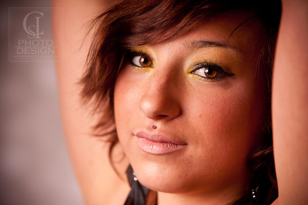 Senior girl close up with gold eyeshadow